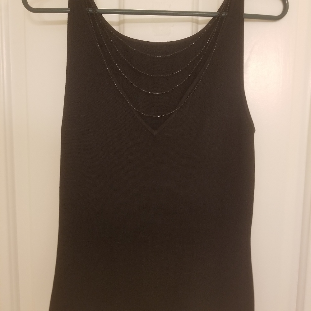 Black top with beads down the back.